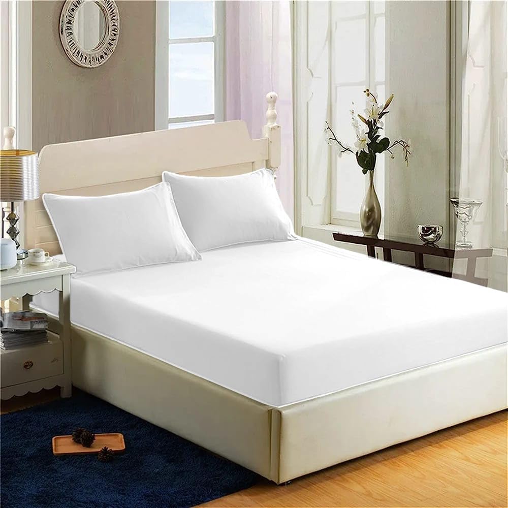 White Filo Magico fitted sheet on a bed